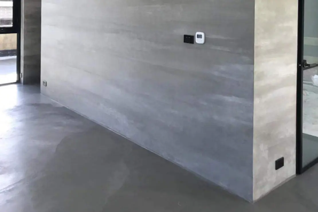 Logement avec des murs et un sol en béton ciré Logement avec des murs et un sol en béton ciré